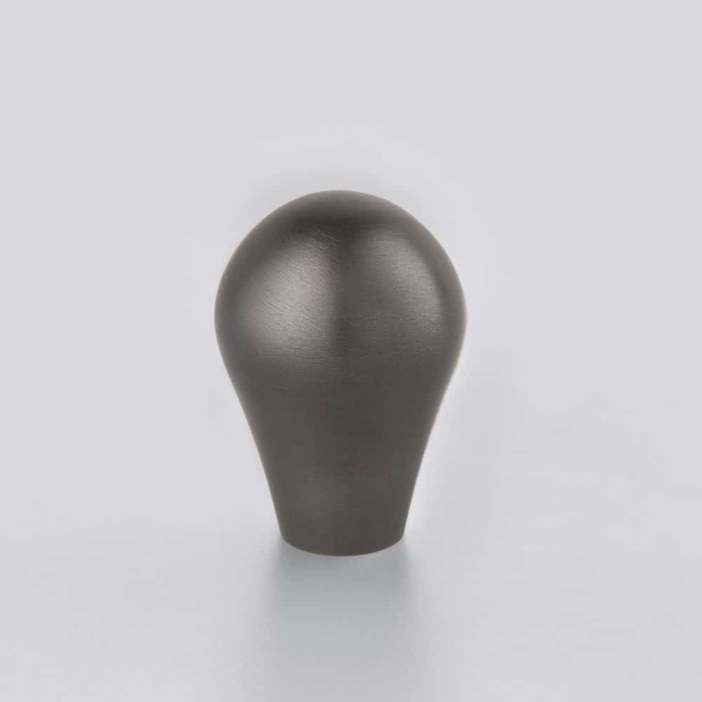 midnightcarbon Horton Brasses Dark metallic bulb shaped object standing on a white surface