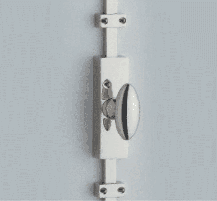 Close up of a white door latch and strike plate on a pale blue door