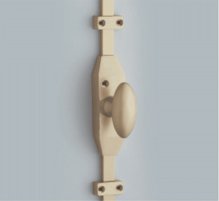 Vertical wooden door handle with a rounded knob mounted on a blue wall wall mounted latchhandle for accessibility purposes
