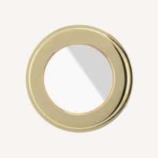 Round gold metal ring with a hollow center and a diagonal light reflection across the inner opening