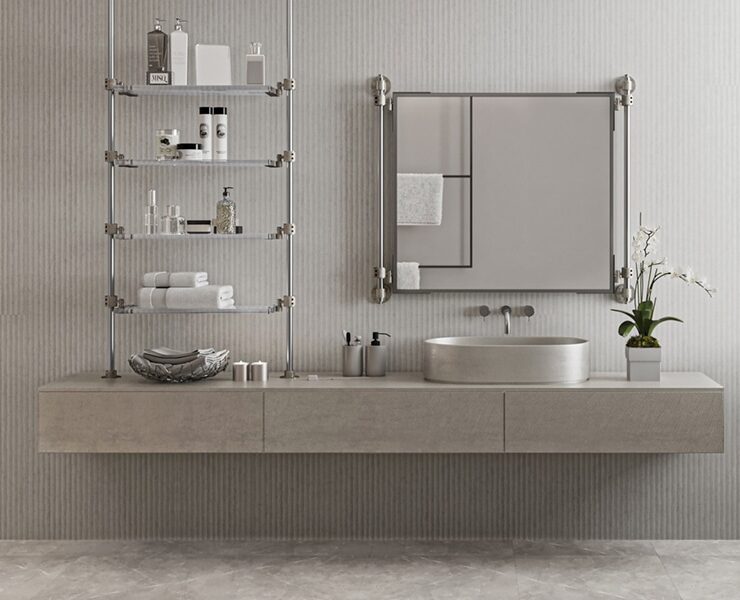 Modern bathroom with a floating vanity, metal open shelving holding towels and toiletries, a round vessel sink, and a potted plant by the window.