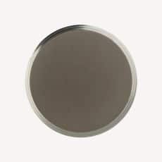 Top down view of a round brown disk with a light silver rim