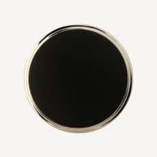 Top down view of a black circular object with a thin silver rim