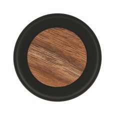 Round wooden disc with a black outer rim viewed from above top down